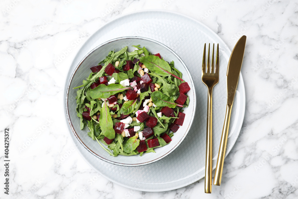 Delicious beet salad served on white marble table, top view Delicious beet salad served on white marble table, top view