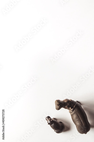 Toy hippopotamus with baby isolated on white background