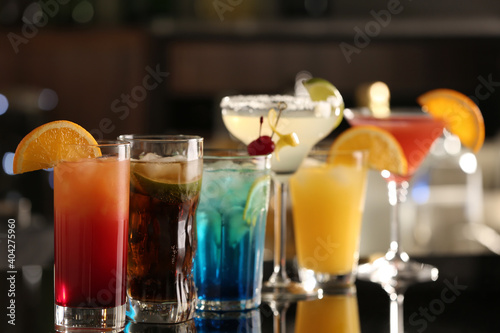 Photography Different delicious cocktails on counter in bar