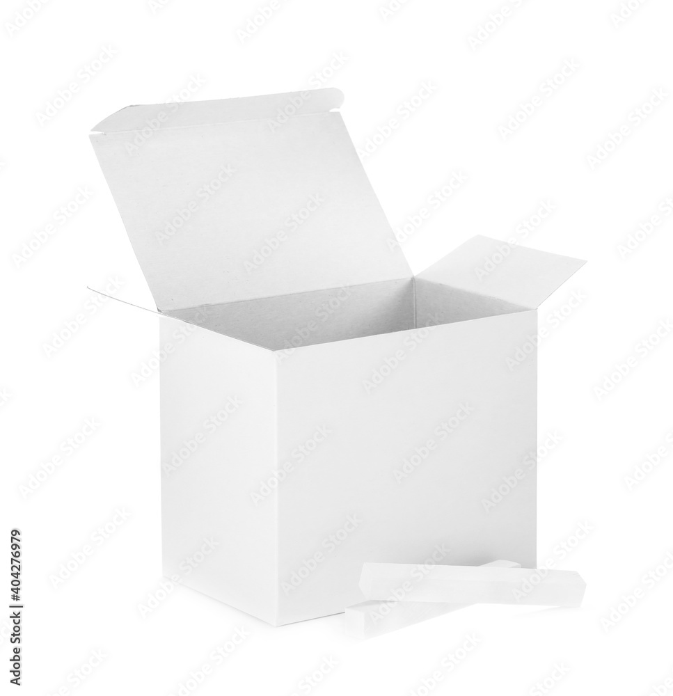 Open box and pieces of chalk on white background Open box and pieces of chalk on white background