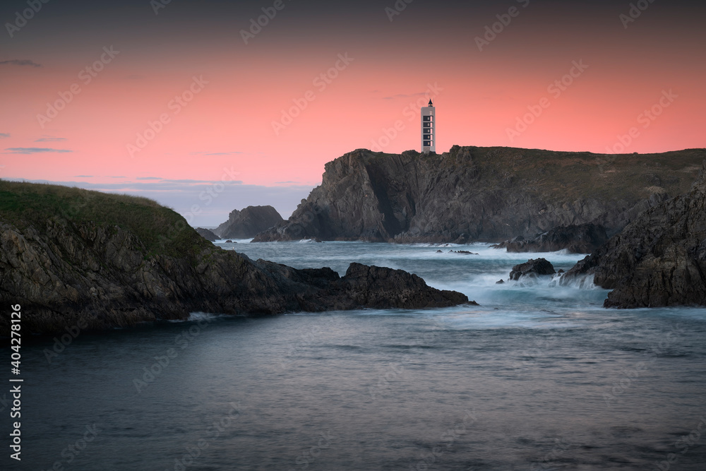 Valdoviño cliffs and Meirás or Punta Frouxeira lighthouse at sunset. Galicia, Spain
