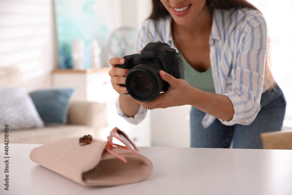 Young photographer taking picture of accessories indoors, closeup Young photographer taking picture of accessories indoors, closeup