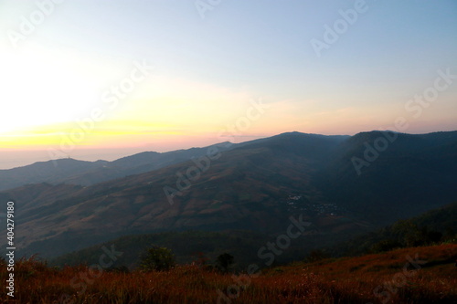 The scenery on the top of the mountain in the morning, mountain peaks in morning fog, at phu lom lo, Loei, Thailand. 