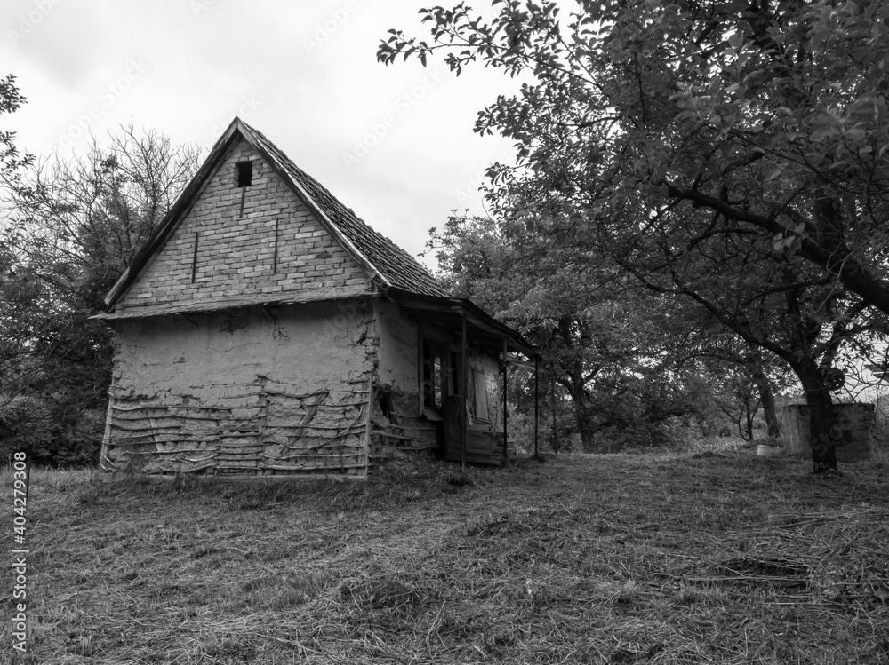 Abandoned traditional house with earthen walls in countryside in ruined shape Abandoned traditional house with earthen walls in countryside in ruined shape