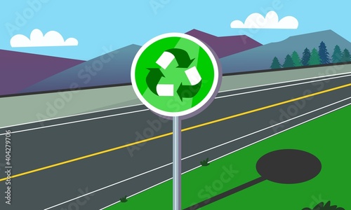 Cartel con símbolo del reciclaje en medio de la carretera.

