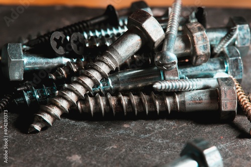 Group of screws on a table in a Workshop