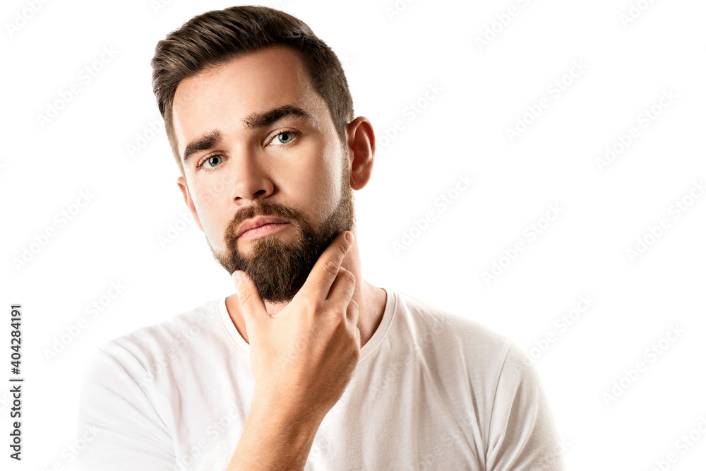 Young and handsome bearded man wearing white t-shirt Young and handsome bearded man wearing white t-shirt
