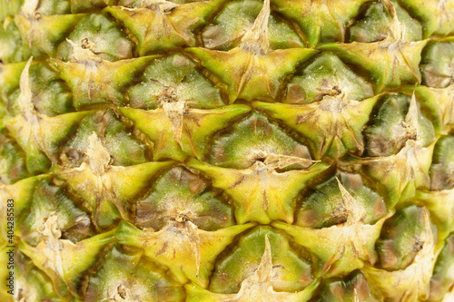 Pineapple background. Close-up of pineapple peel.