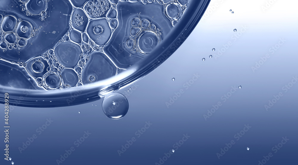 Macro PHOTO abstract of oil and water drops in blue monochrome