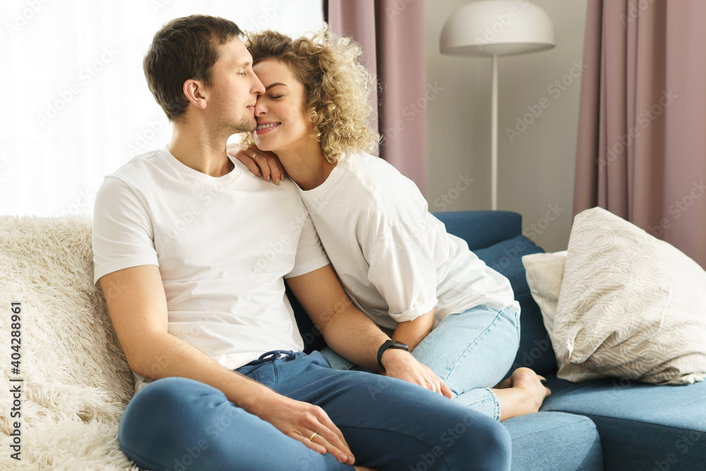 Young and happy couple relaxing at home Young and happy couple relaxing at home
