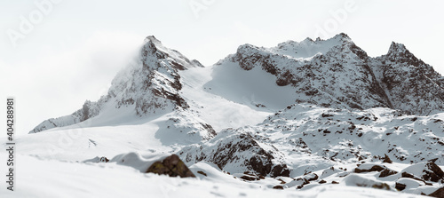 Swiss Mountain Peak covered with Fog an Snow