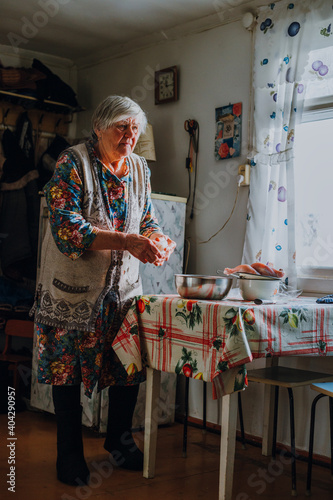Russian granny butchering a chicken with her bare hands