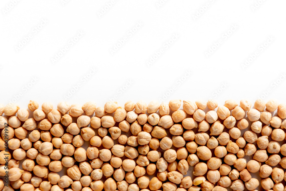 Pile of chickpeas arranged below image with white background. Nutrition and wellness. Legumes and food Pile of chickpeas arranged below image with white background. Nutrition and wellness. Legumes and food