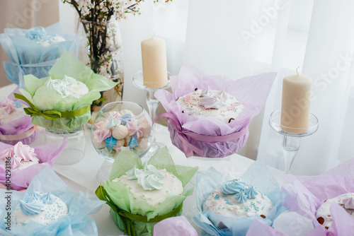 Beautiful Easter cakes on a decorated light table. A light holiday of Easter.