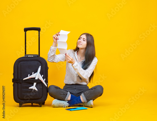 Traveler is holding a list ...