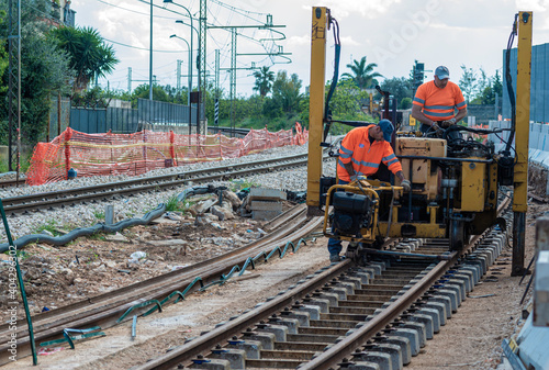 Construction workers at work at Railway station. Construction of a new railway line at a city station.