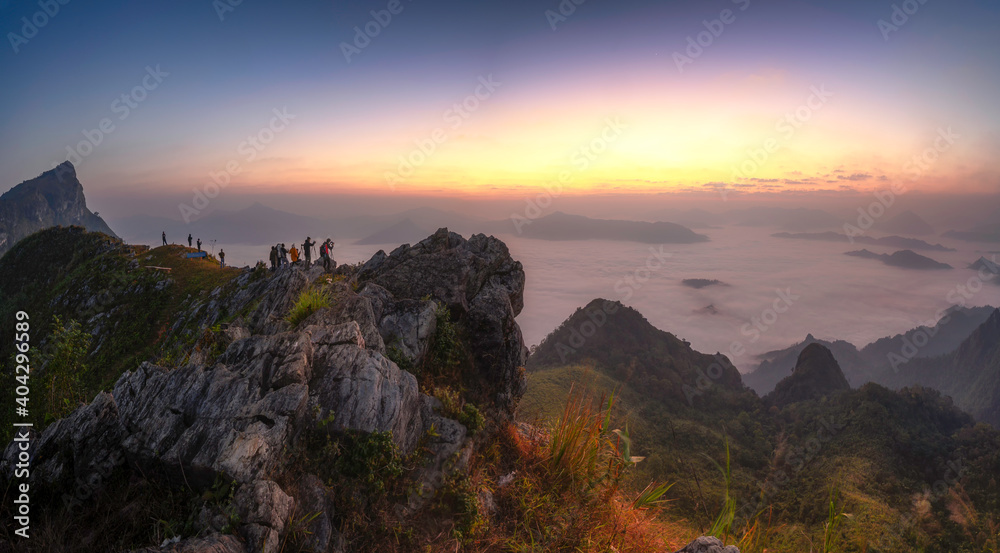 The mountain features a long ridge, a viewpoint, sea mist and sunrise, name Doi Pha Mon, Chiang Rai, Thailand.