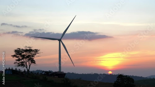 Wind turbines at during sunset.