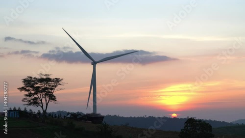 Wind turbines at during sunset.