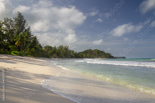 Lonesome tropical beach on Praslin, Seychelles.