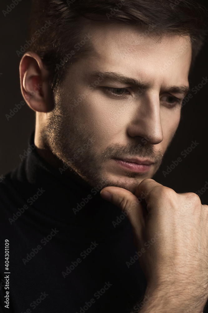 Young handsome man wearing a polo neck