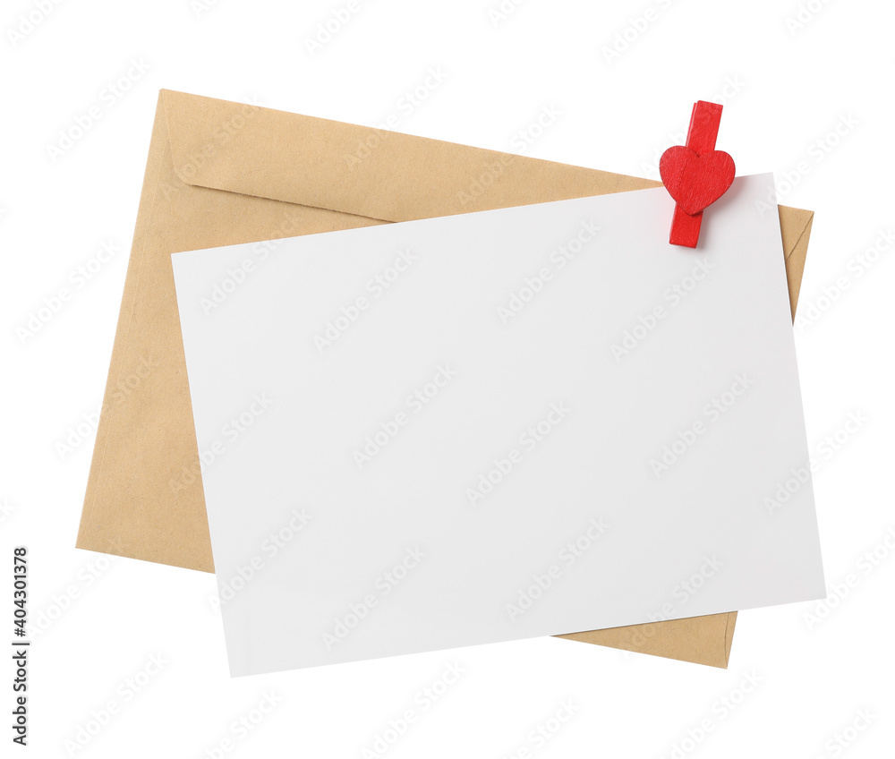Blank card, envelope and decorative clothespin on white background, top view. Valentine's Day celebration Blank card, envelope and decorative clothespin on white background, top view. Valentine's Day celebration