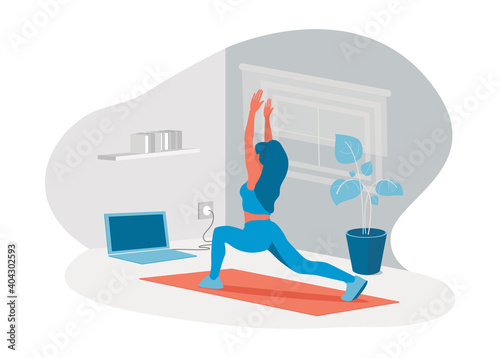 Woman exercising at home through online training