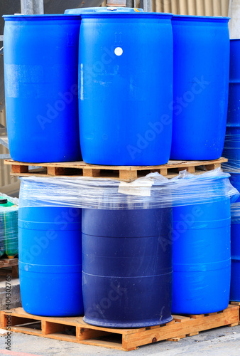 Vertical blue packed barrels on paletts