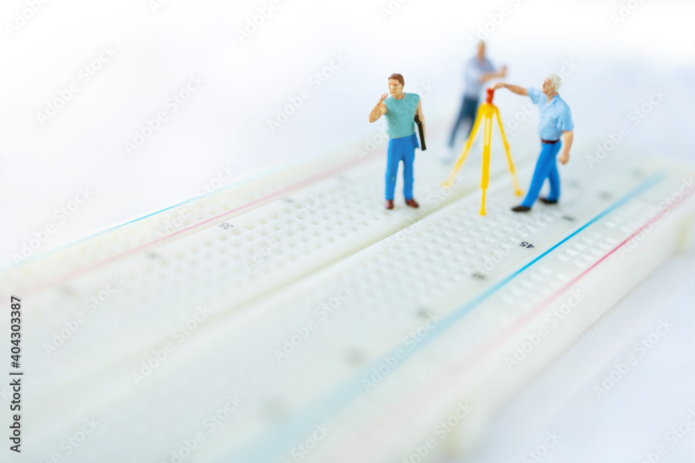 Miniature people searching or checking for bugs and issue on microchip, mainboard of computer. Vulnerability search and security system concept. Miniature people searching or checking for bugs and issue on microchip, mainboard of computer. Vulnerability search and security system concept.