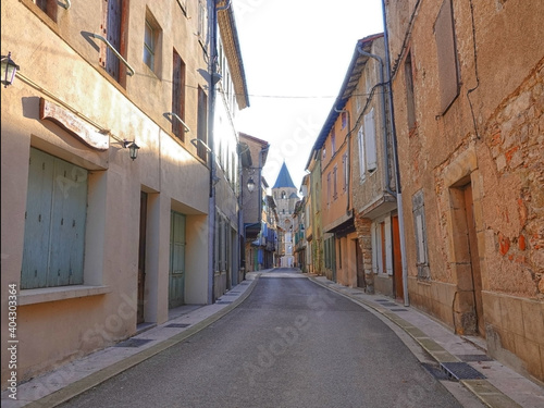 Fototapeta Naklejka Na Ścianę i Meble -  A narrow street in an empty provincial town