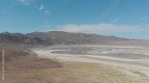 Aerial view of the dried mountain lake Bartogay. River bed along the bottom of the lake. photo