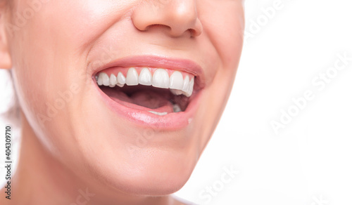 Female face with white teeth isolated on white background.