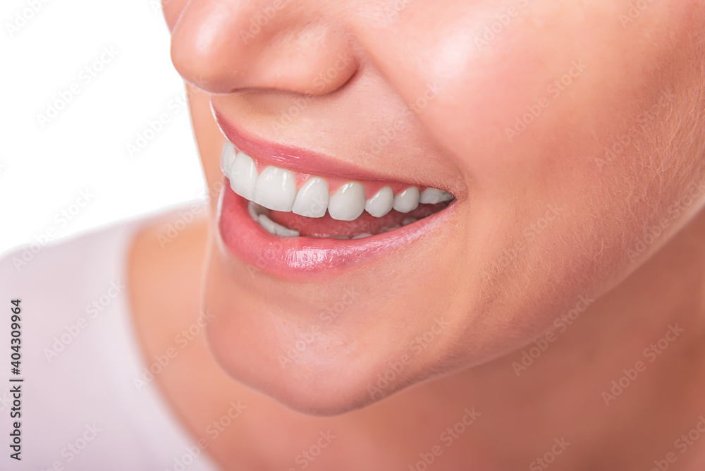 Obraz premium Female face with white teeth isolated on white background.