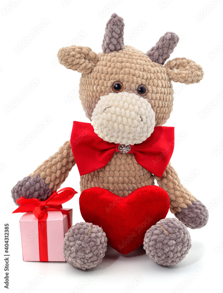 Knitted bull in a butterfly with a heart. Knitted bull in a butterfly with a heart.