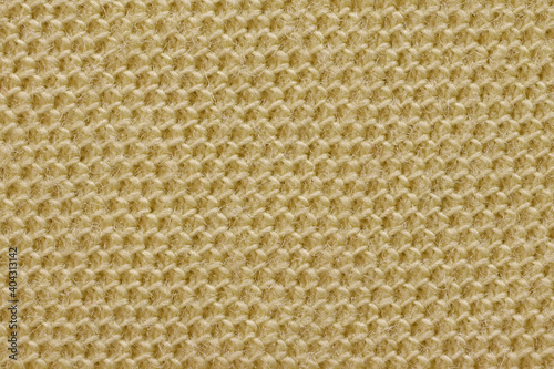 Texture of yellow cotton fabric, close-up.