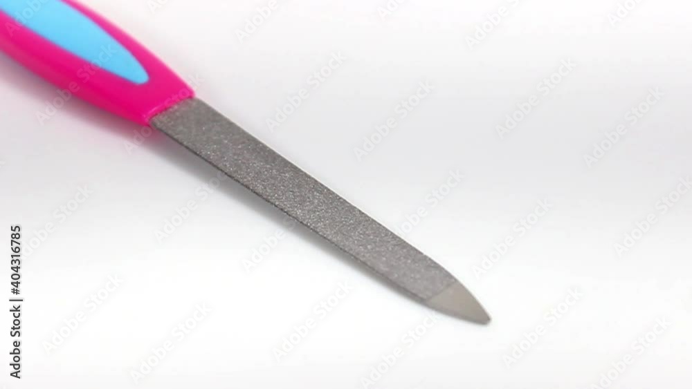 Manicure nail file on a white background. Turntable. Selective shot. Manicure nail file on a white background. Turntable. Selective shot.