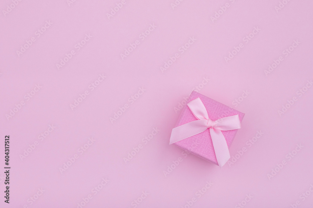 Creative minimal concept with gift box on pastel pink background. Flat lay design Creative minimal concept with gift box on pastel pink background. Flat lay design