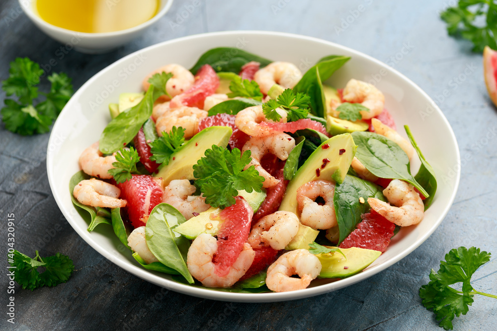 Fresh Avocado Grapefruit shrimp salad in white plate Fresh Avocado Grapefruit shrimp salad in white plate