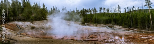 Panorama shot of steam from hot small lake thermal spring in yellowstone national park