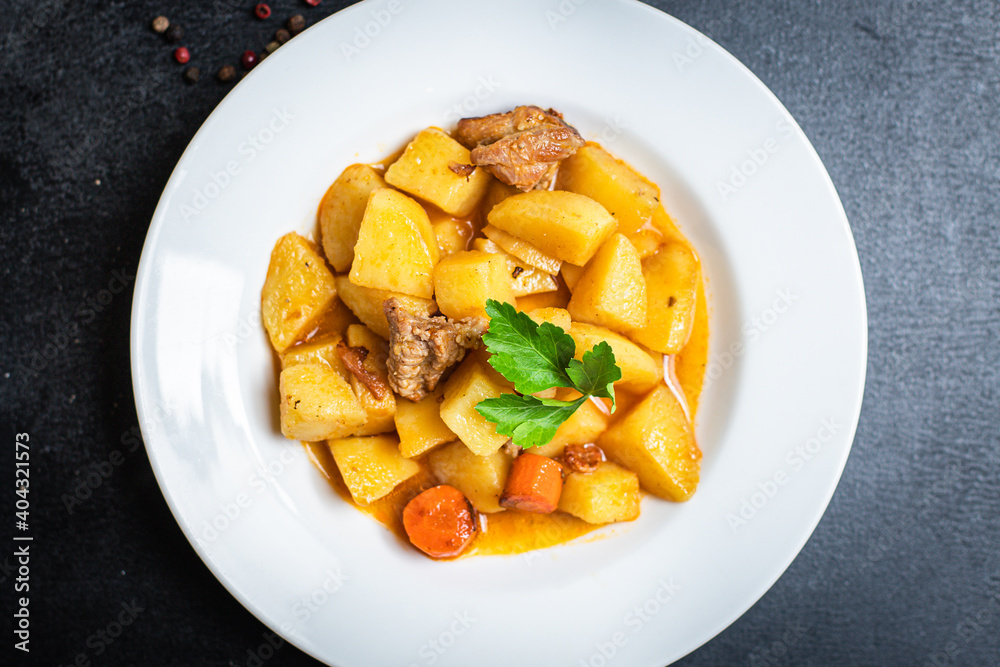goulash with potatoes and meat stewed vegetables and pork ready to eat on the table for healthy meal snack outdoor top view copy space for text food background rustic image goulash with potatoes and meat stewed vegetables and pork ready to eat on the table for healthy meal snack outdoor top view copy space for text food background rustic image