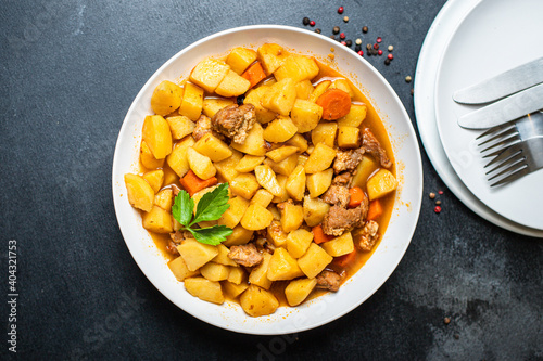goulash with potatoes and meat stewed vegetables and pork ready to eat on the table for healthy meal snack outdoor top view copy space for text food background rustic image