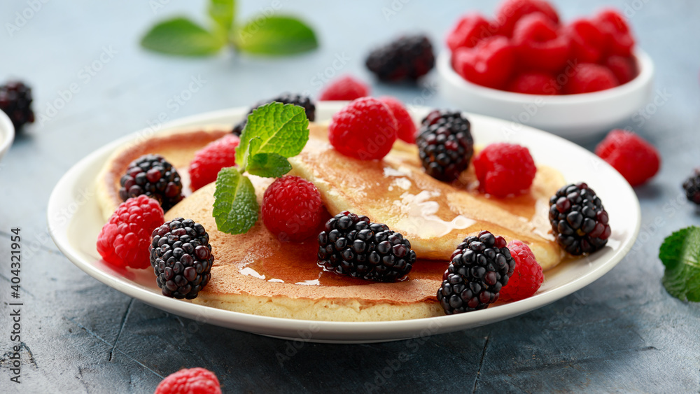 Morning breakfast Pancakes with fresh berry and honey. Healthy food