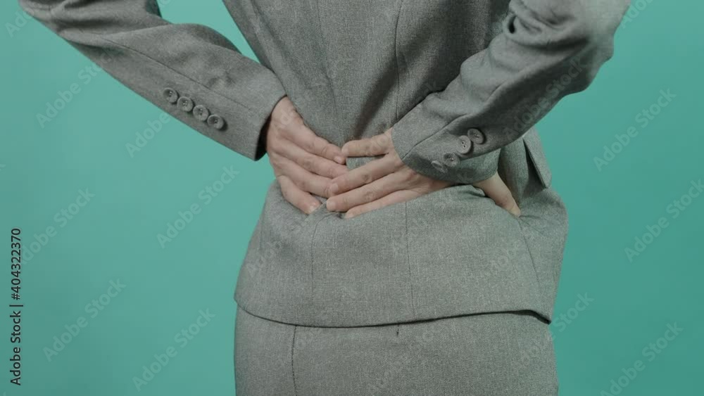 Backache. Lower Back Pain. Unhealthy business woman in working suit ...