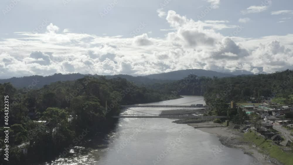 Aerial view; approaching two large bridges for cars over a large river in South America Aerial view; approaching two large bridges for cars over a large river in South America