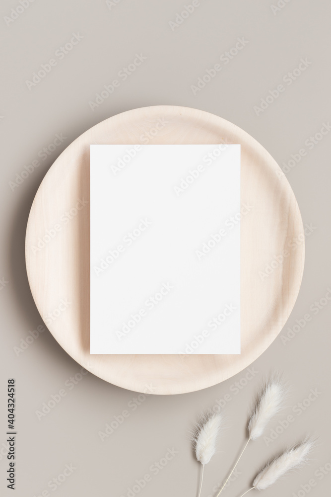 White invitation card mockup on a wooden plate with a lagurus decoration. 5x7 ratio, similar to A6, A5. White invitation card mockup on a wooden plate with a lagurus decoration. 5x7 ratio, similar to A6, A5.
