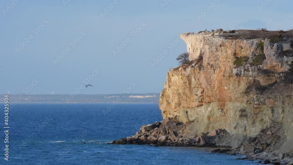 Eroding limestone cliff next to ocean, Gotland, Sweden Eroding limestone cliff next to ocean, Gotland, Sweden