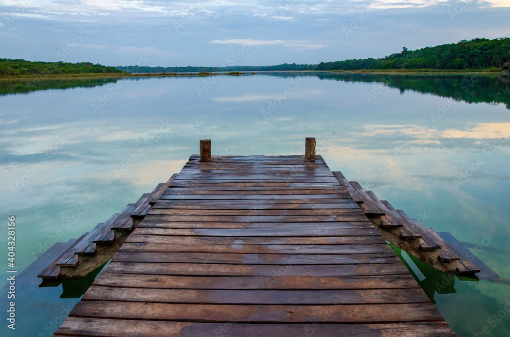 Fototapeta premium wooden pier on tropical lake - punta laguna, coba, yucatan, mexico