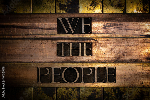 We The People text on vingtage bronze and copper background