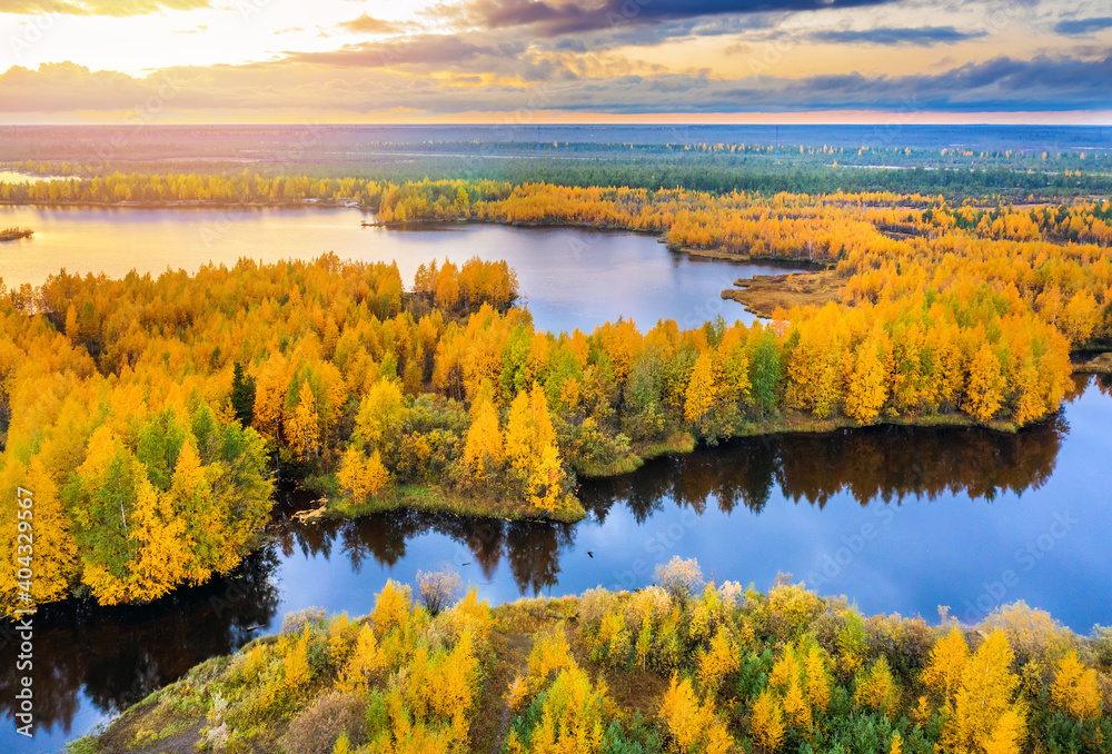  Colorful autumn landscape. Forest lake with autumn forest. Western Siberia