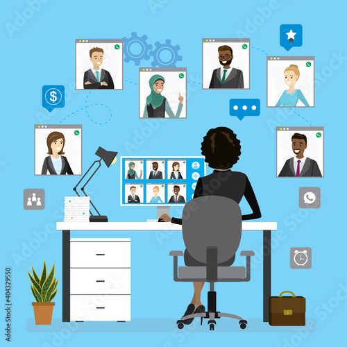 Group video conference, teamwork. African american business woman sitting at workplace, rear view. Remote negotiations,